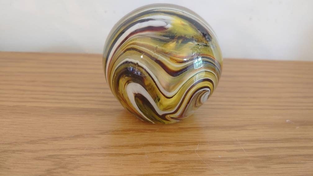 Striped Yellow, Black and White Paperweight.