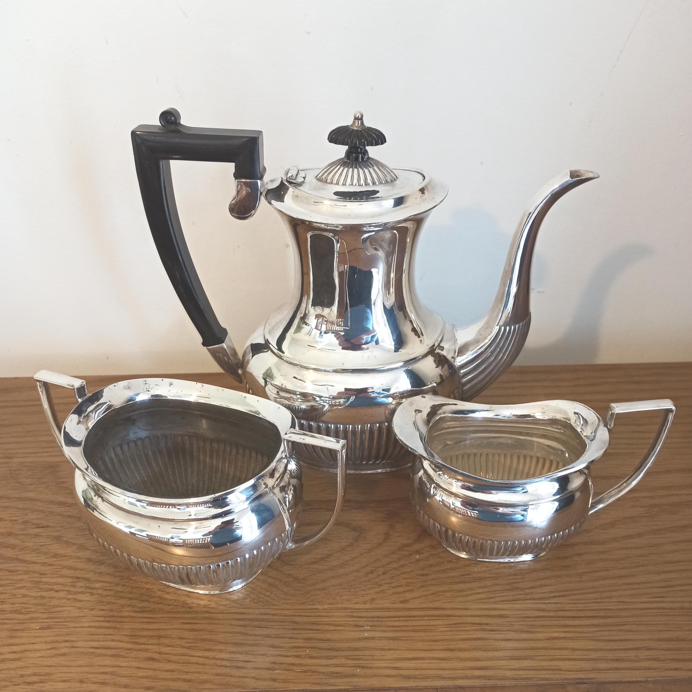 Silver Plated Tea Set. Teapot, Twin Handled Sugar Bowl and Milk Jug. A.1
