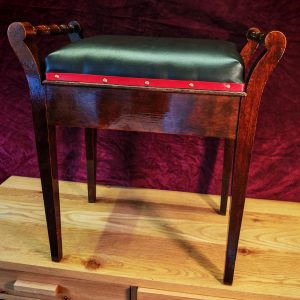Vintage Single Seat Piano Stool - Refurbished. Soft Brown Leatherette with Red Leatherette Trim and Copper Pins. Very Good Condition